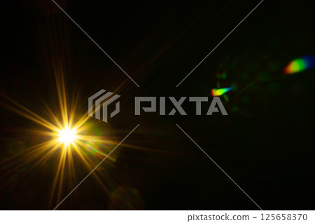 Sun flare on the black background Sun flare on the black background 125658370