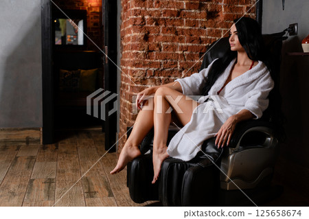 Woman in lingerie posing gracefully in a modern interior space 125658674