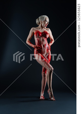 Expression of art with a detailed body painting design featuring blood Expression of art with a detailed body painting design featuring blood 125658823