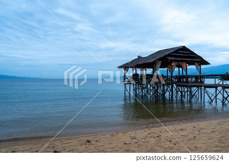 Wooden pier on the beach of Lake Poso, Tentena, Sulawesi Wooden pier on the beach of Lake Poso, Tentena, Sulawesi 125659624