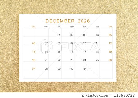 December 2026 calendar page on gold glitter background. 125659728
