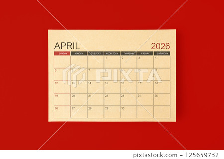 April 2026 desk calendar made from brown paper page on red background. April 2026 desk calendar made from brown paper page on red background. 125659732