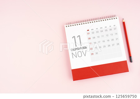 Top view November 2026 desk calendar and pencil, Position with copy space. 125659750