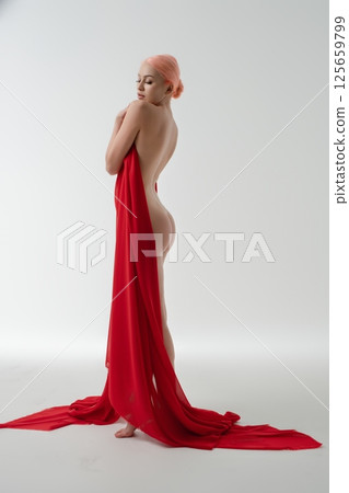 Beauty and elegance of the female form captured in light drapery and soft colors Beauty and elegance of the female form captured in light drapery and soft colors 125659799