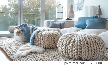 Knitted decor adds warmth and texture with cozy blankets and pillows, bringing comfort and style. 125660069