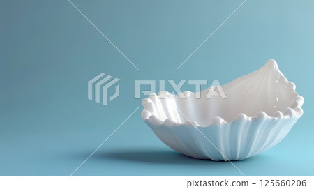 White ceramic seashell bowl on blue background, minimalist design concept 125660206