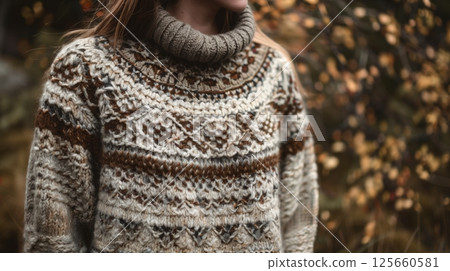 Cozy knitted sweater with intricate patterns and rich textures, perfect for staying warm. Cozy knitted sweater with intricate patterns and rich textures, perfect for staying warm. 125660581