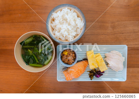 Balanced Japanese breakfast set with salmon and rolled egg 125660865