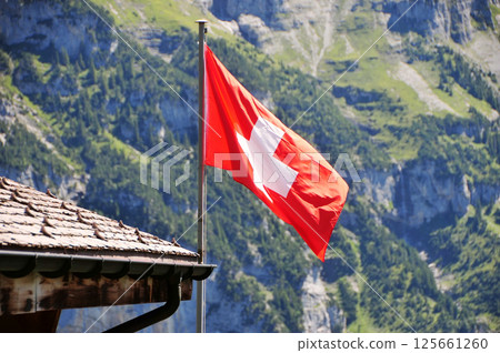 Swiss flag flying on the roof Swiss flag flying on the roof 125661260
