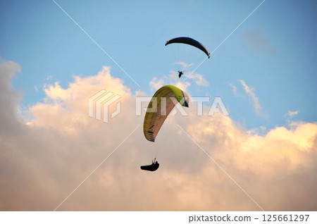 Two paragliders in the sky 125661297