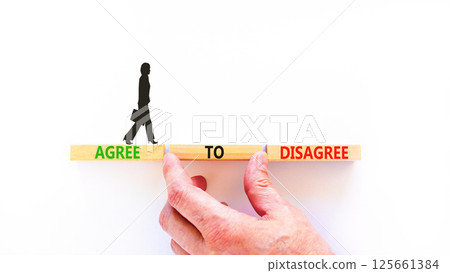 Agree to disagree symbol. Concept words Agree to disagree on beautiful wooden block. Businesswoman's icon. Beautiful white background. Business and agree to disagree concept. Copy space. Agree to disagree symbol. Concept words Agree to disagree on beautiful wooden block. Businesswoman's icon. Beautiful white background. Business and agree to disagree concept. Copy space. 125661384