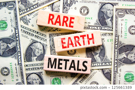 Rare earth metals symbol. Concept words Rare earth metals on beautiful wooden blocks. Dollar bills. Beautiful background from dollar bills. Business and rare earth metals concept. Copy space. Rare earth metals symbol. Concept words Rare earth metals on beautiful wooden blocks. Dollar bills. Beautiful background from dollar bills. Business and rare earth metals concept. Copy space. 125661389