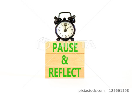 Pause and reflect symbol. Concept words Pause and reflect on beautiful block. Black alarm clock. Beautiful white background. Business motivational lifestyle pause and reflect concept. Copy space. 125661398