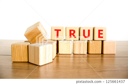 True symbol. Concept word True on beautiful wooden blocks. Beautiful wooden table white background. Business, lifestyle, support and true concept. Copy space. True symbol. Concept word True on beautiful wooden blocks. Beautiful wooden table white background. Business, lifestyle, support and true concept. Copy space. 125661437