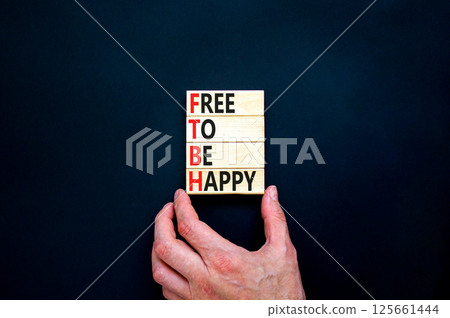 FTBH Free To Be Happy symbol. Concept word FTBH Free To Be Happy on beautiful wooden blocks. Beautiful black background. Business motivational FTBH Free To Be Happy concept. Copy space. FTBH Free To Be Happy symbol. Concept word FTBH Free To Be Happy on beautiful wooden blocks. Beautiful black background. Business motivational FTBH Free To Be Happy concept. Copy space. 125661444