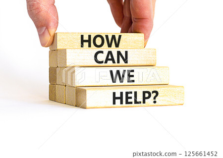 How can we help symbol. Concept words How can we help on beautiful wooden blocks. Beautiful white table white background. Businessman hand. Business and how can we help concept. Copy space. How can we help symbol. Concept words How can we help on beautiful wooden blocks. Beautiful white table white background. Businessman hand. Business and how can we help concept. Copy space. 125661452