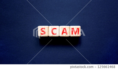 Scam symbol. Concept word Scam on beautiful wooden blocks. Beautiful black table black background. Business, lifestyle, support and scam concept. Copy space. 125661468