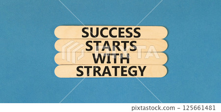 Success starts with strategy symbol. Concept words Success starts with strategy on beautiful wooden sticks. Beautiful blue background. Business and success starts with strategy concept. Copy space. 125661481