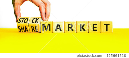 Stock or share market symbol. Concept words Stock market or Share market on beautiful wooden blocks. Beautiful white background. Businessman hand. Business stock or share market concept. Copy space. 125661518