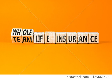 Term or whole life insurance symbol. Concept words Term life insurance or Whole life insurance on wooden blocks. Beautiful orange background. Business term or whole life insurance concept. Copy space. 125661522