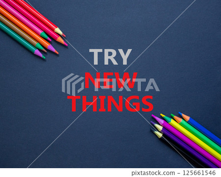 Try new things symbol. Concept words Try new things on beautiful black paper. Colored pencils. Beautiful black background. Business motivational lifestyle try new things concept. Copy space. Try new things symbol. Concept words Try new things on beautiful black paper. Colored pencils. Beautiful black background. Business motivational lifestyle try new things concept. Copy space. 125661546