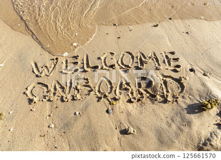 Business welcome onboard concept. Concept word Welcome onboard written on beautiful Red sea sand beach. Beautiful Red sea ocean sand beach background, copy space. Business welcome onboard concept. 125661570