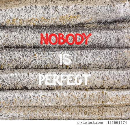 Nobody is perfect symbol. Concept words Nobody is perfect on beautiful grey stone. Beautiful grey mountain stone background. Business motivational lifestyle and nobody is perfect concept. Copy space. Nobody is perfect symbol. Concept words Nobody is perfect on beautiful grey stone. Beautiful grey mountain stone background. Business motivational lifestyle and nobody is perfect concept. Copy space. 125661574