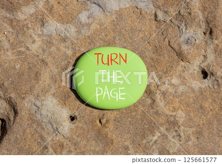 Turn the page symbol. Concept words Turn the page on beautiful green stone. Beautiful brown stone background. Business motivational lifestyle turn the page concept. Copy space. Turn the page symbol. Concept words Turn the page on beautiful green stone. Beautiful brown stone background. Business motivational lifestyle turn the page concept. Copy space. 125661577
