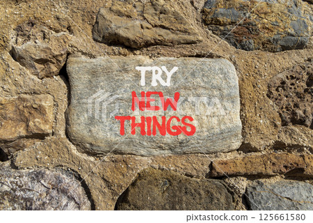 Try new things symbol. Concept words Try new things on beautiful grey stone wall. Beautiful stone wall background. Business motivational lifestyle try new things concept. Copy space. Try new things symbol. Concept words Try new things on beautiful grey stone wall. Beautiful stone wall background. Business motivational lifestyle try new things concept. Copy space. 125661580