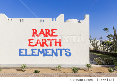 Rare earth elements symbol. Concept words Rare earth elements on beautiful white wall. Beautiful white wall blue sky background. Business and rare earth elements concept. Copy space. 125661581