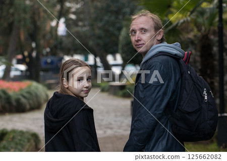 Happy family together. Young girl daughter and her father portrait 125662082