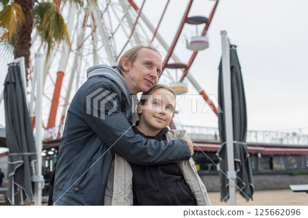 Young daughter child girl and her father walking outdoors. Happiness, childhood and bonding concept Young daughter child girl and her father walking outdoors. Happiness, childhood and bonding concept 125662096