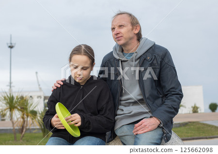 Father and daughter young girl in spring day outdoors. Happy family, childhood 125662098