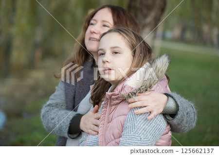 Happy family having fun in park. Mother and daughter portrait 125662137