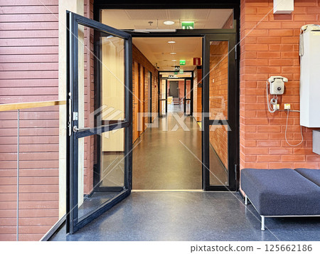 Loft empty office corridor with open door, horizontal building background 125662186