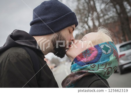 Outdoors portrait of young couple expressing their feelings on the street 125662319