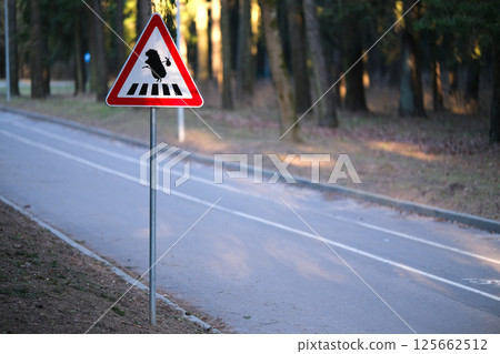 A road sign warning that there may be hedgehogs on the road 125662512