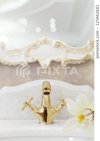 Luxurious bathroom detail. Interior of bathroom with sink, faucet and mirror 125662681