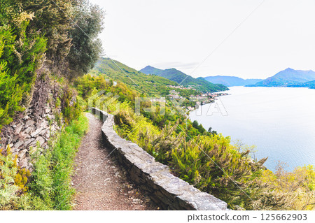 On the path of the viandanti on the banks of Lake Lecco On the path of the viandanti on the banks of Lake Lecco 125662903