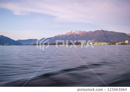 a winter ferry ride with snow capped mountains as the perfect backdrop a winter ferry ride with snow capped mountains as the perfect backdrop 125663064