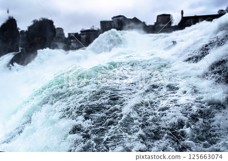 A powerful display of nature the majestic Rhine Falls roaring with unstoppable force A powerful display of nature the majestic Rhine Falls roaring with unstoppable force 125663074