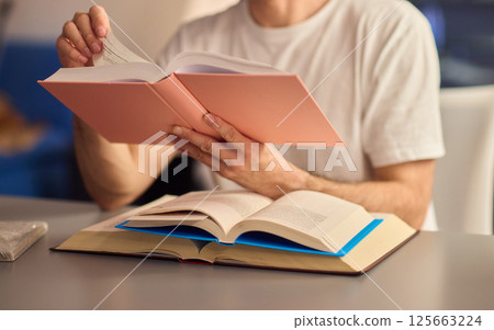 A Delightful and Charming Evening Reading Mood Enhanced with Soft, Ambient Lighting 125663224