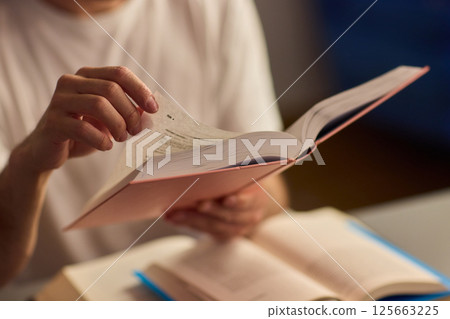 A Delightful and Charming Evening Reading Mood Enhanced with Soft, Ambient Lighting A Delightful and Charming Evening Reading Mood Enhanced with Soft, Ambient Lighting 125663225