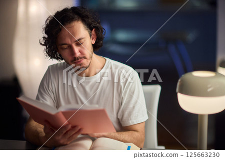 A Delightful and Charming Evening Reading Mood Enhanced with Soft, Ambient Lighting 125663230