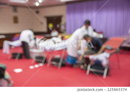 Blurred background of Out Patient Department(OPD) of a hospital with patients. Blurred background of Out Patient Department(OPD) of a hospital with patients. 125663374