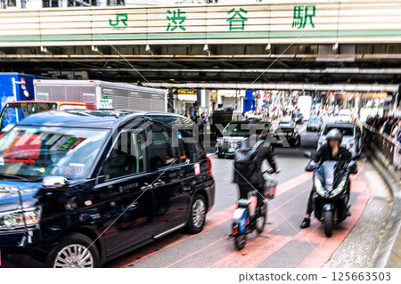 Tokyo cityscape in Japan Dangerous driving and impact of bicycles! Hello where are you running? = In front of Shibuya Station Tokyo cityscape in Japan Dangerous driving and impact of bicycles! Hello where are you running? = In front of Shibuya Station 125663503