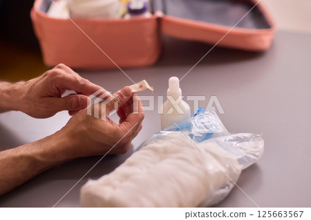 Healthcare Preparations Hand Holding Essential Medical Supplies for Effective Care Healthcare Preparations Hand Holding Essential Medical Supplies for Effective Care 125663567
