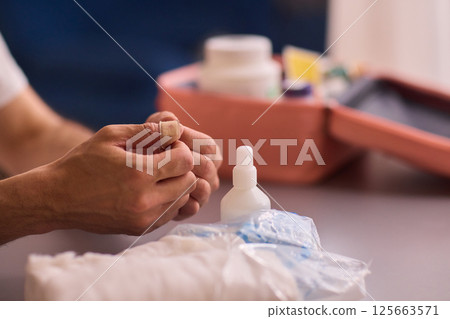 Healthcare Preparations Hand Holding Essential Medical Supplies for Effective Care 125663571
