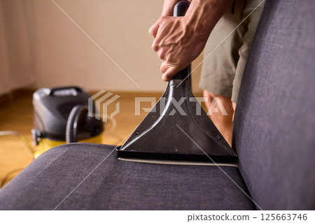 The Professional Upholstery Cleaning Process is in full action, showcasing its effectiveness 125663746