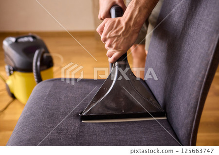 The Professional Upholstery Cleaning Process is in full action, showcasing its effectiveness 125663747